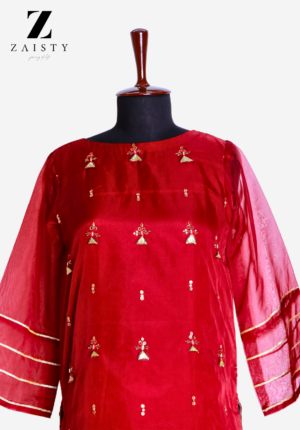 Red 3-piece organza suit with hand embroidery and raw silk flared trousers.